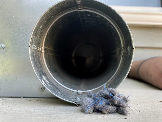 Cimarron Hills Dryer Vent Cleaning technician using specialized equipment to clear severe dryer vent blockage in Cimarron Hills